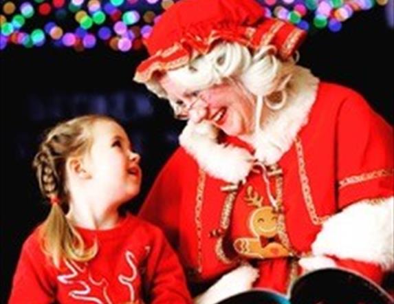 Image is of Mrs Claus and child