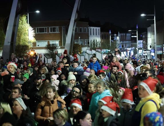 Image is of crowd of people waiting for the Christmas Tree Switch on at Bow Street Lisburn