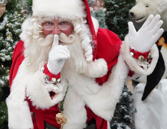 Image is of Santa Claus making a quiet gesture re the Quiet Grotto at Dobbies Garden Centre