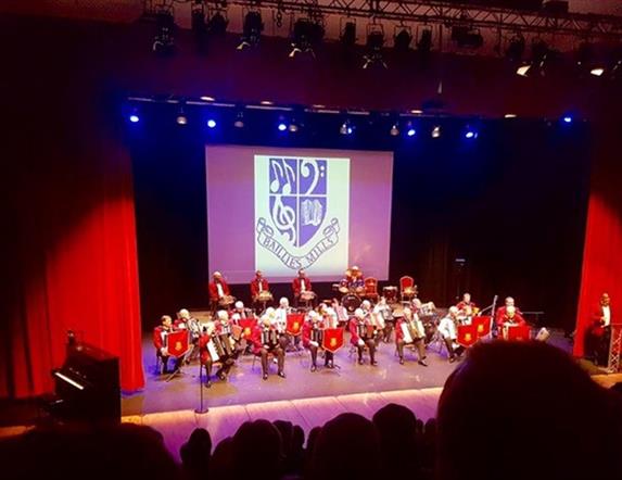 Image of band on stage in Island Hall