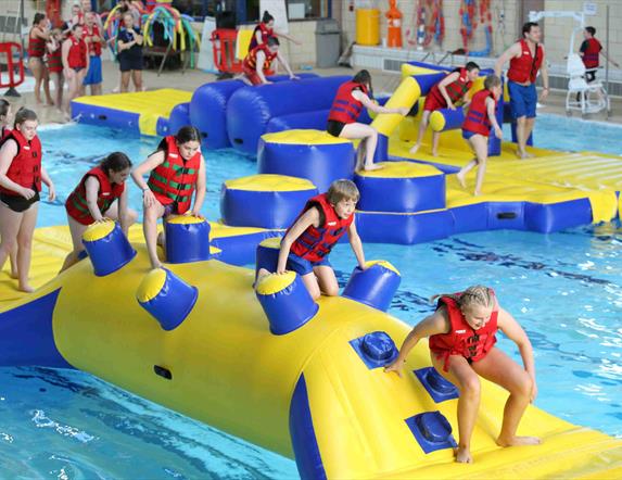 Image is of children in the pool at the Lagan Valley Leisureplex