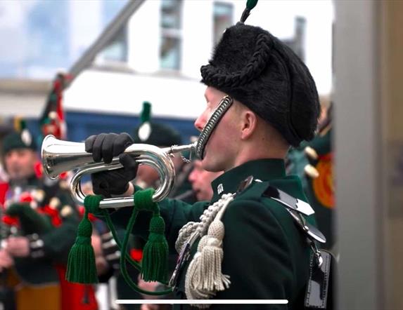 Image is of a bugler playing