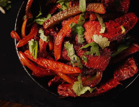 A plate of colourful food served at Spice