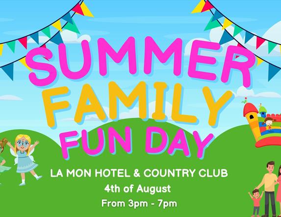 Image is of the Summer Family Fun Day at La Mon Hotel showing rainbow flags, a bouncy castle and cartoon people