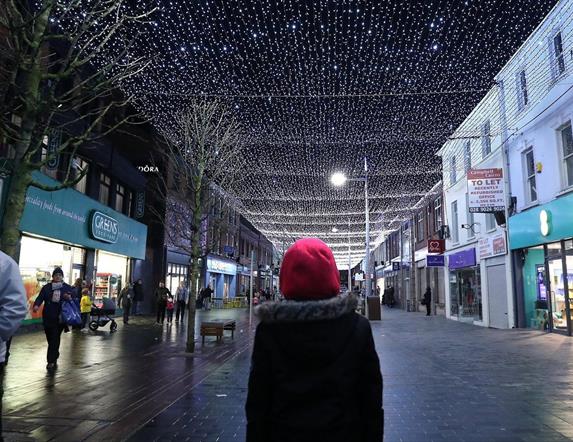 Image is of a person watching Light Canopy on Bow Street Lisburn