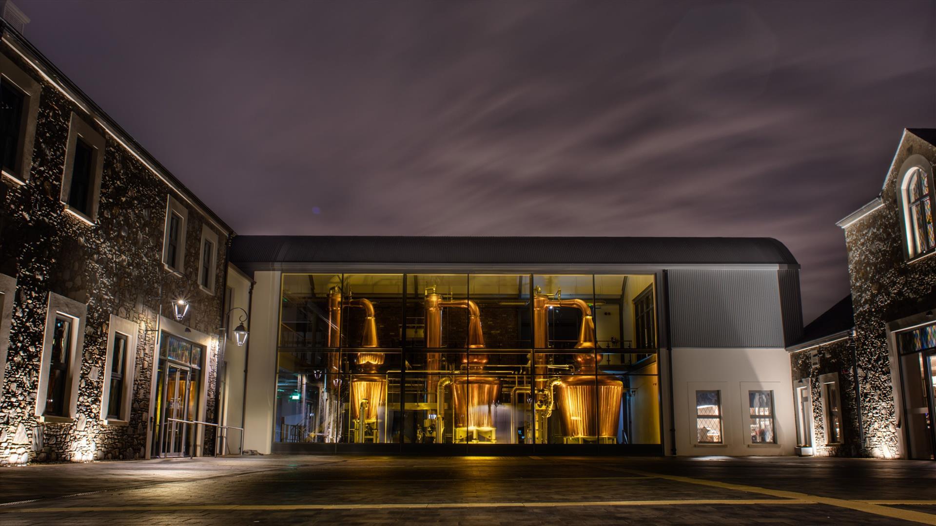 Hinch Distillery exterior at night