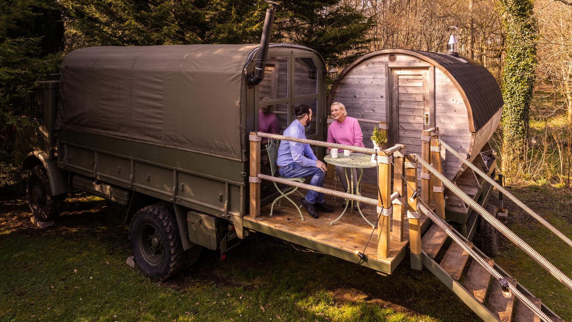 Couple drinking coffee outside Myrtle the Glamping Truck @ Larchfield Estate