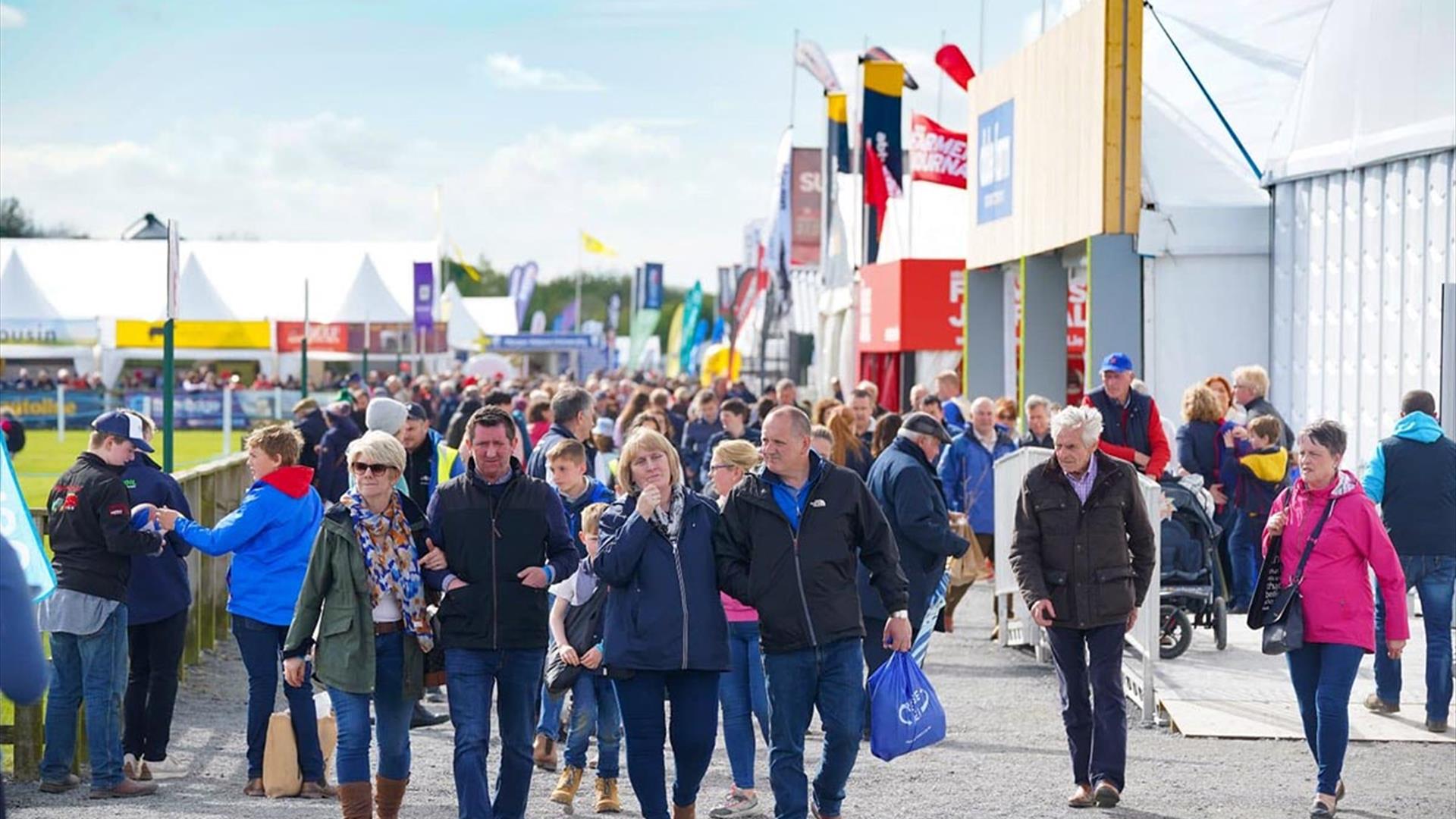 Image is of visitors walking around the Balmoral Show in Lisburn