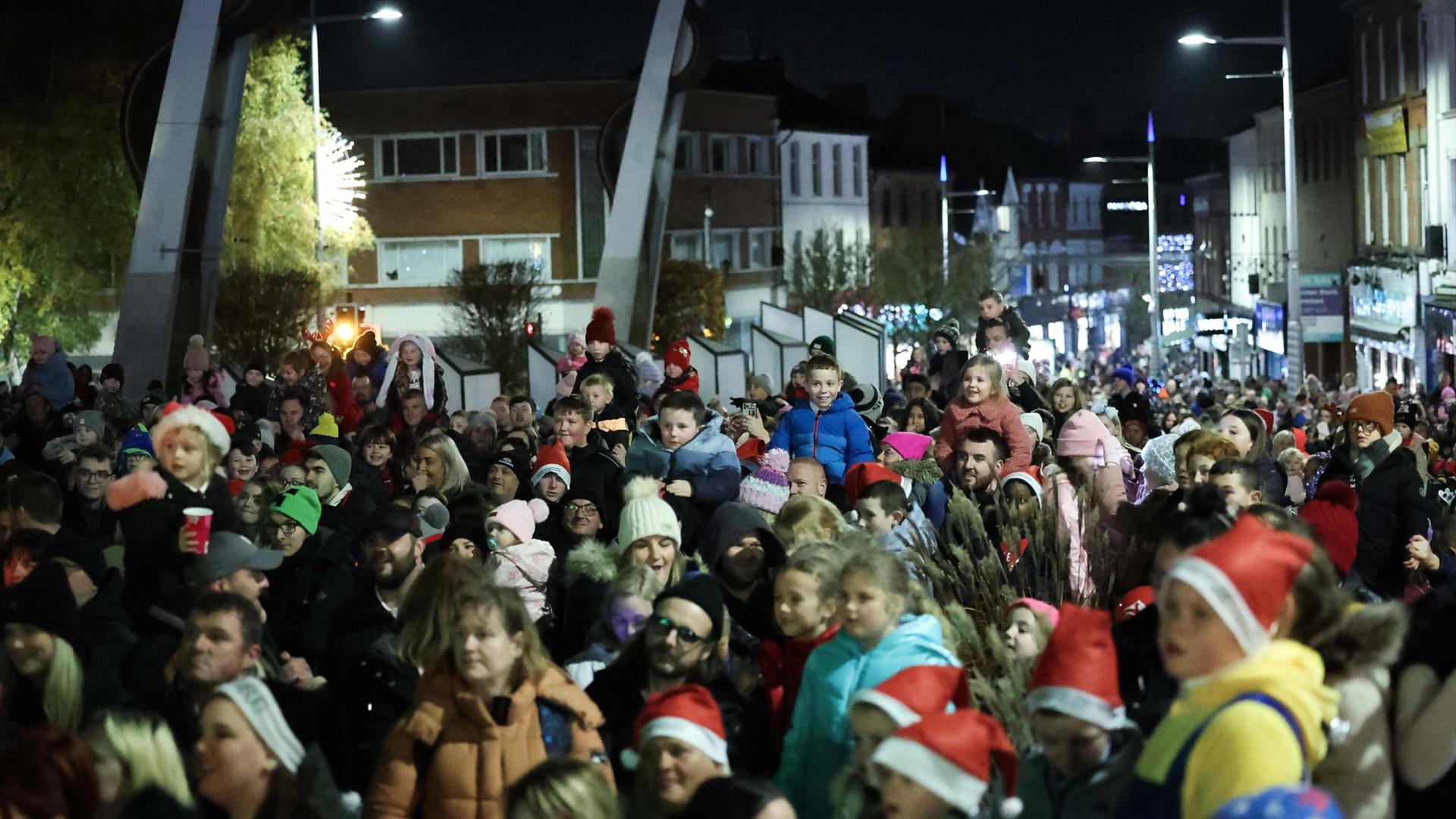 Image is of crowd of people waiting for the Christmas Tree Switch on at Bow Street Lisburn