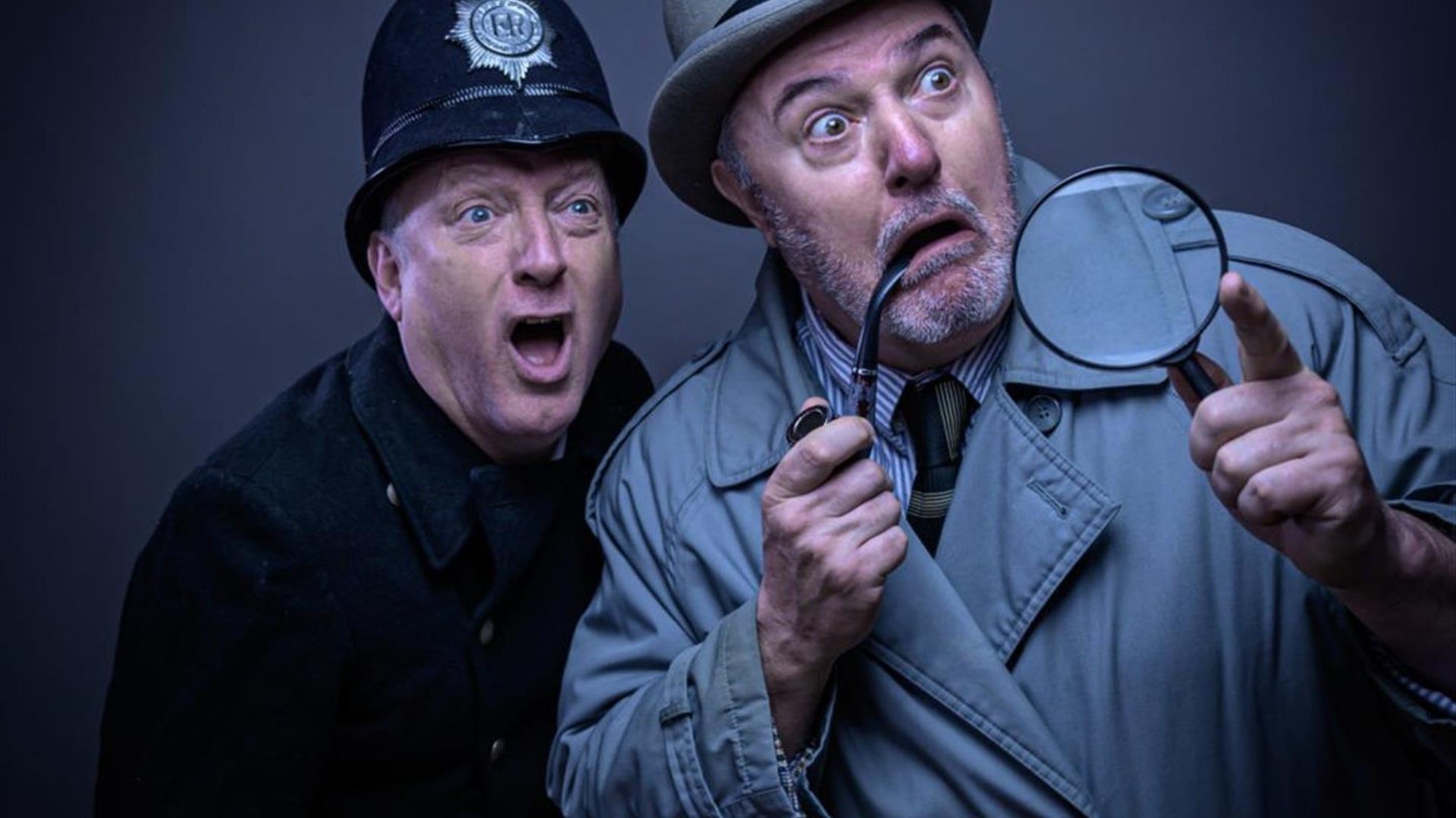 Two men one dressed as a policeman and one as a Sherlock Holmes