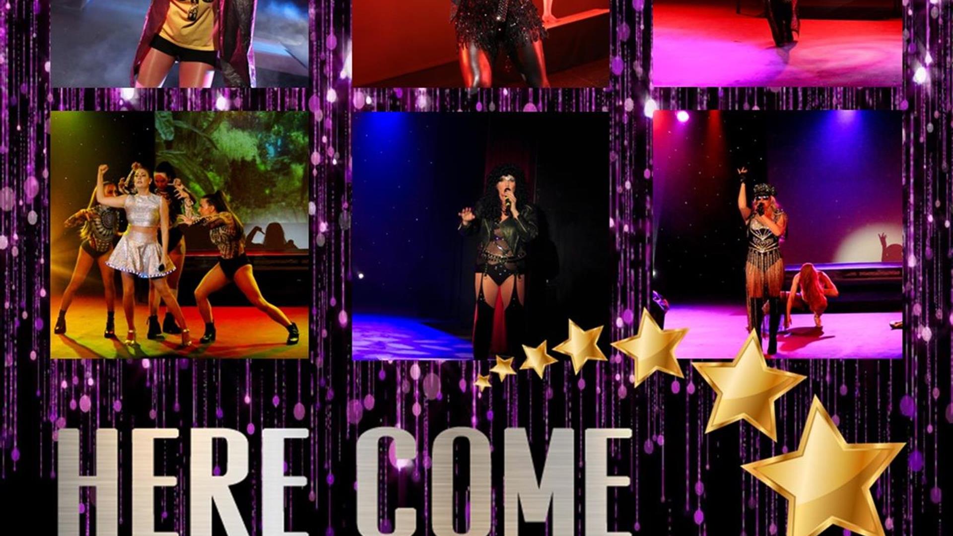 Image is of the various performers on the stage at Here Come The Girls show