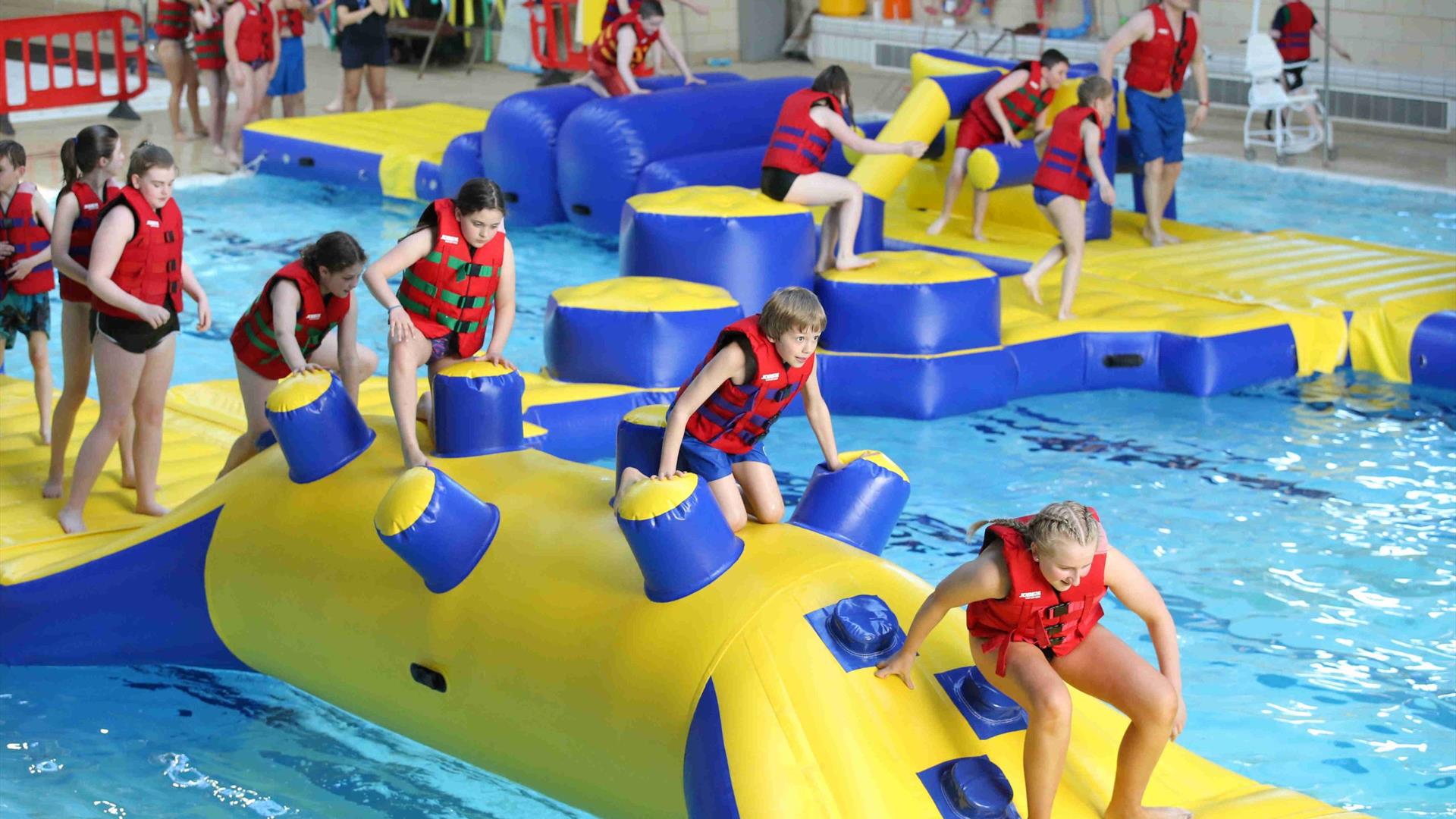 Image is of children in the pool at the Lagan Valley Leisureplex