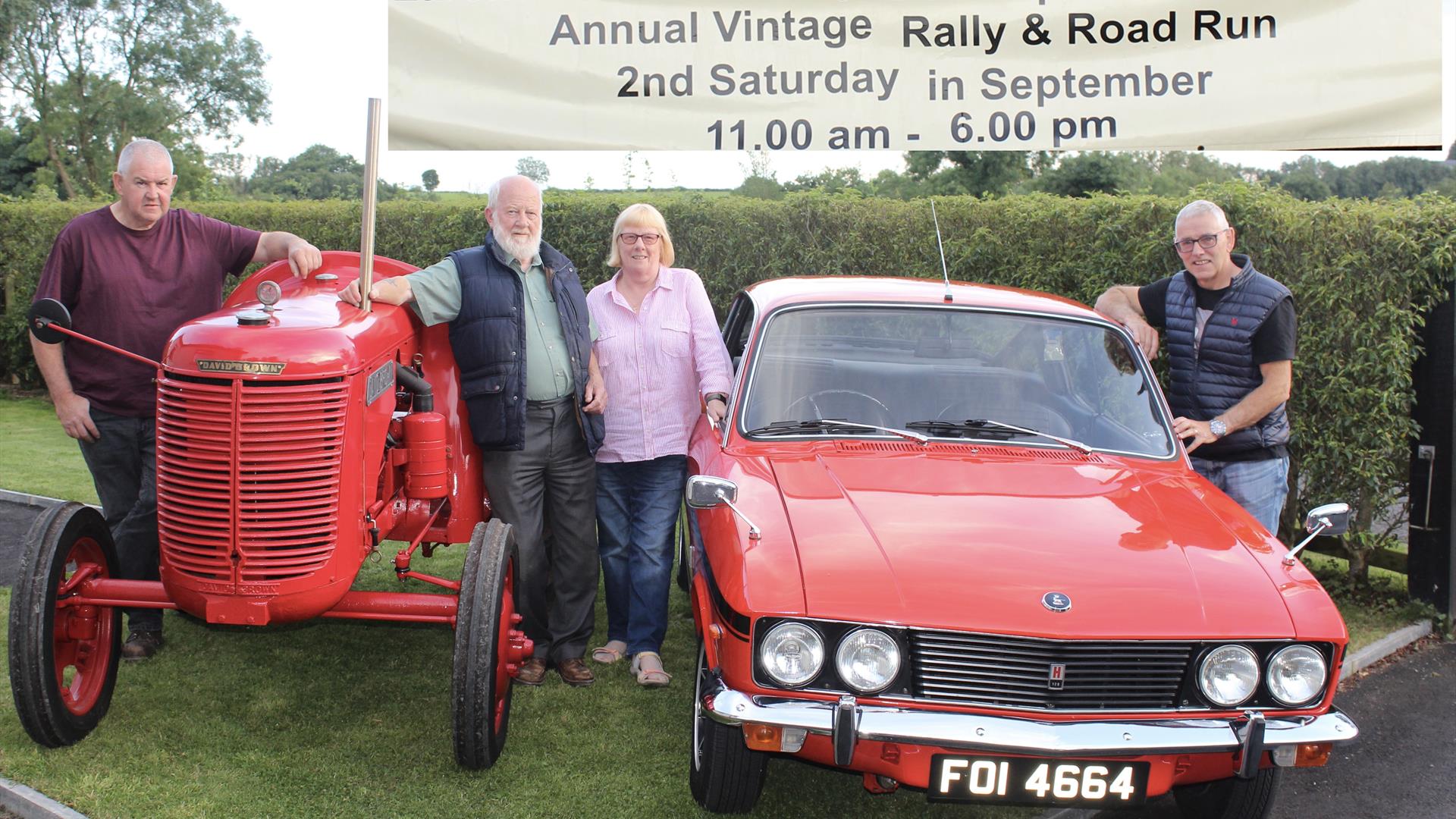 Image is of classic car and tractor with banner advertising Larchfield Community Fun Day