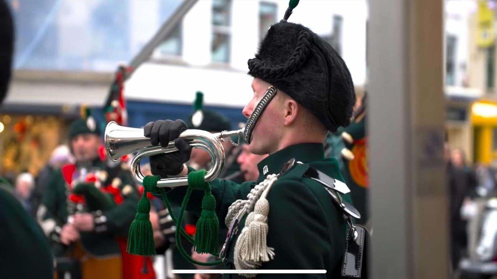 Image is of a bugler playing