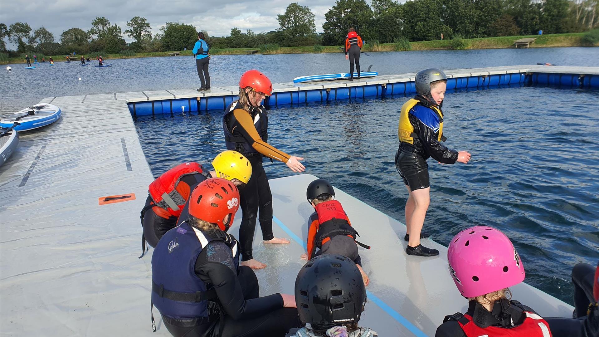 Image is of children preparing to paddle at Moira Lakes