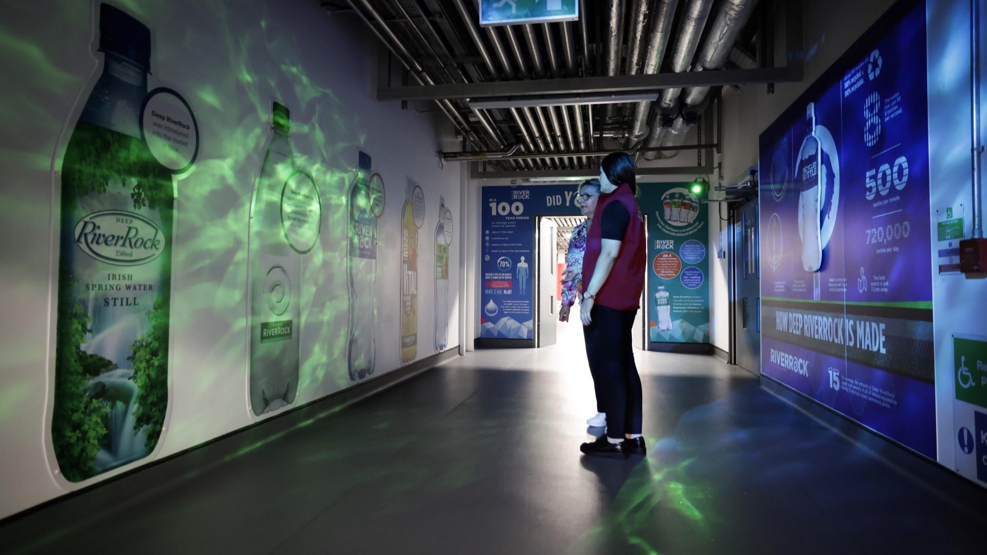 Image is of a corridor showing the different Coca-Cola brands