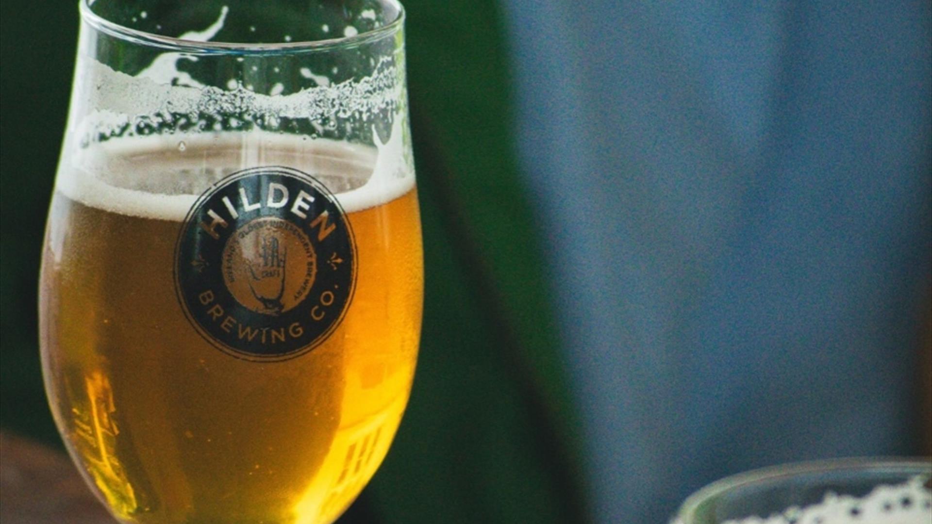 Image shows a glass of Hilden beer with text showing dates 18-20 October and Tickets available soon