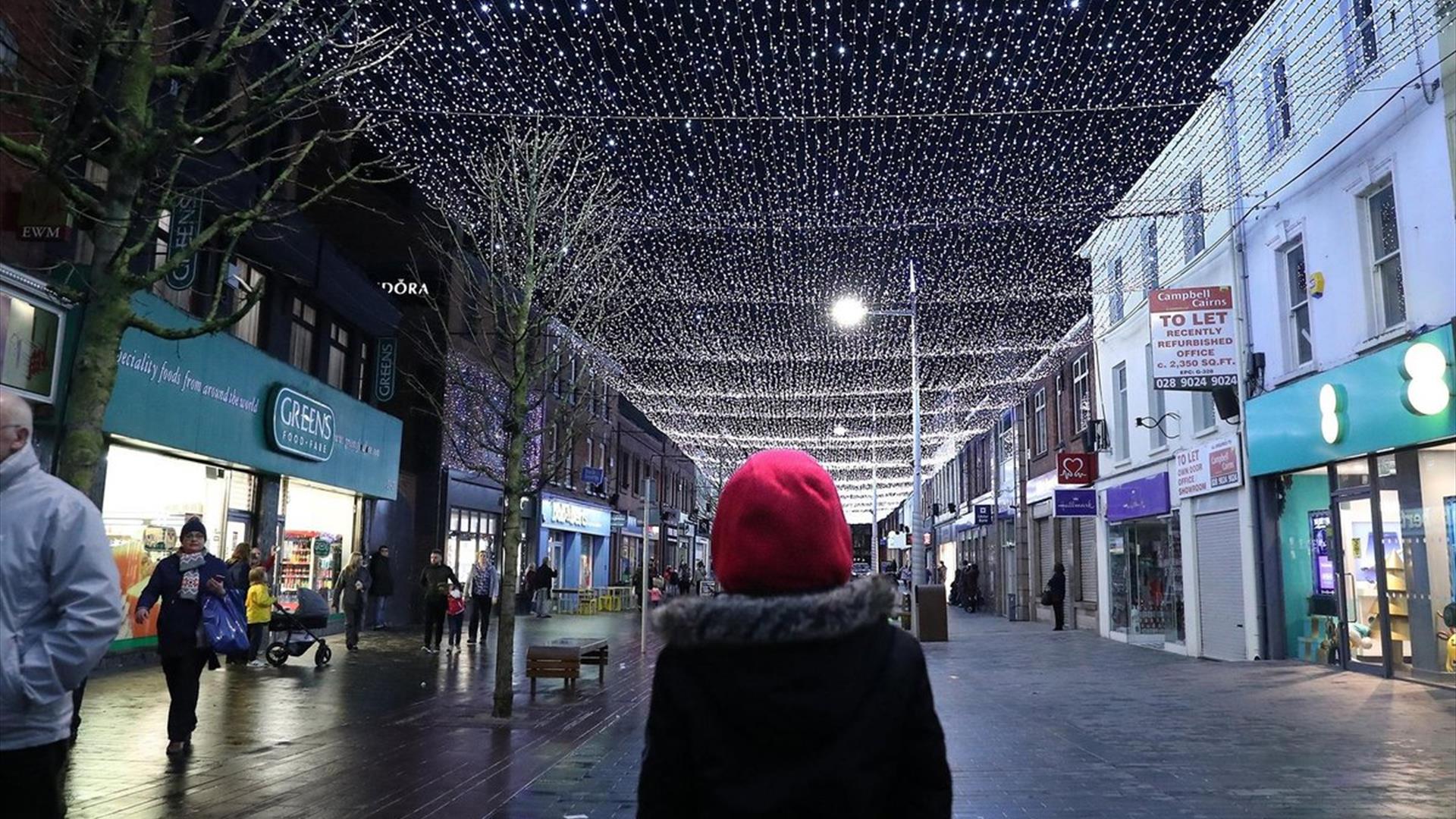 Image is of a person watching Light Canopy on Bow Street Lisburn