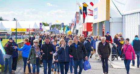 Image is of visitors walking around the Balmoral Show in Lisburn