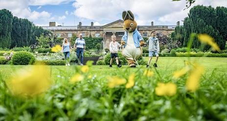 Family with Peter Rabbit in front of Hillsborough Castle