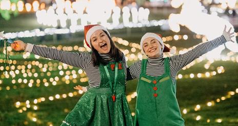 Image is of 2 girls dressed as Elves re the Elfie Tour