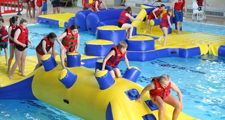 Image is of children in the pool at the Lagan Valley Leisureplex