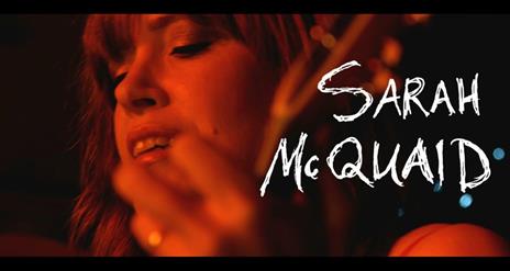 Image is of the singer Sarah McQuaid