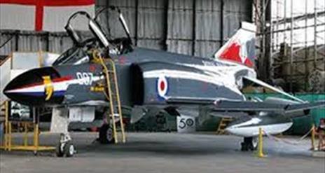 Image shows one of the aircraft on display in a hangar