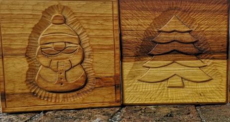 Image is of Christmas wood carvings