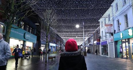 Image is of a person watching Light Canopy on Bow Street Lisburn