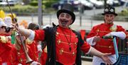 Man in costume and face paint at Mayor's Carnival Parade
