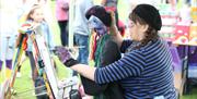 Painting stand at Mayor's Carnival Parade
