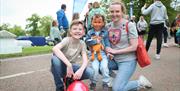 Family image, child with face paint at Mayor's Carnival Parade
