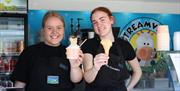 Picture of 2 staff members serving ice cream