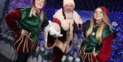 Picture of Santa with two elves