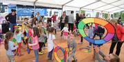 Children dancing with swirls in Market Square