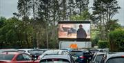 Cars at drive-in cinema at Let's Go Hydro