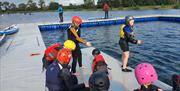 Image is of children preparing to paddle at Moira Lakes