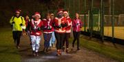 Ladies running with santa hats for Mayor's charity