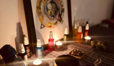 Image is of a treatment room burning candles and incense