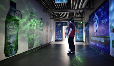 Image is of a corridor showing the different Coca-Cola brands