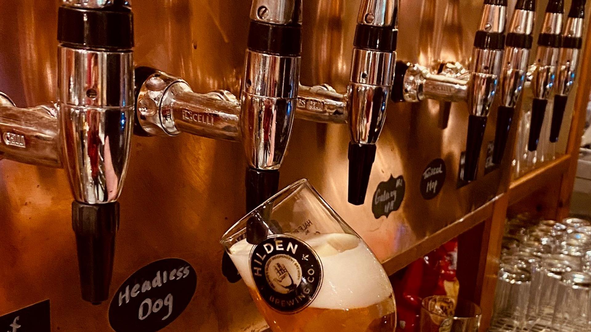 Image is of a beer being pulled on tap at Hilden Brewery Image is of a beer being pulled on tap at Hilden Brewery