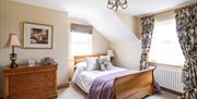 Image of a bedroom at Drum Manor with dual aspect windows