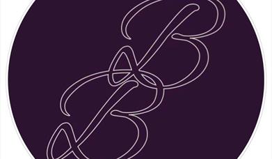 image shows logo for Beauty Boulevard, a large purple circle with initials BB written in purple scroll text